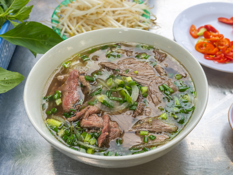 Pho Beef Noodles Soup with Vegetables and Bean Sprouts