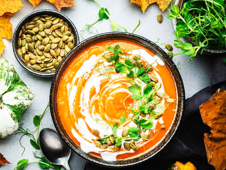 Vegan Pumpkin & Carrot Soup with Toasted Pumpkin Seeds, Coconut Cream & Microgreens