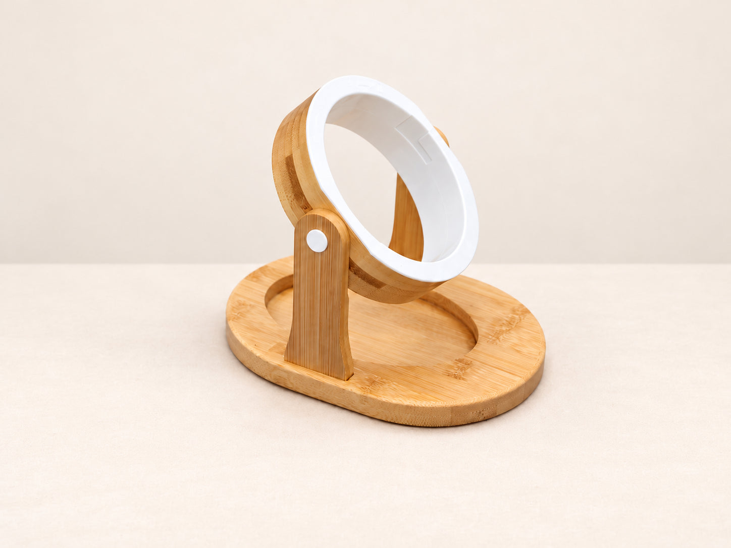 The bamboo stand on its own: a bamboo ring lined with a fitted white ring, held on an upright above an oval bamboo base